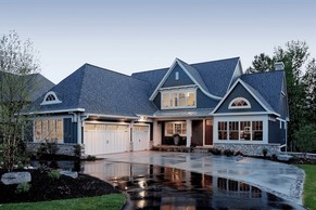 Cottage house with shingle style details.